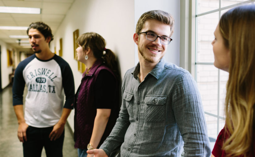 Students socializing in the hallway between classes.
