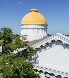 The golden Criswell dome against a backdrop of bright blue sky